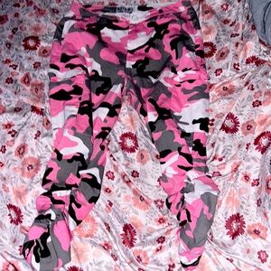 Scrunched up pink white and black army print pants